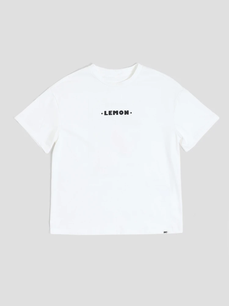 Camiseta de manga corta de ajuste regular con cuello redondo, estampado de texto en el pecho y gráfico de limón fresco para niños preadolescentes