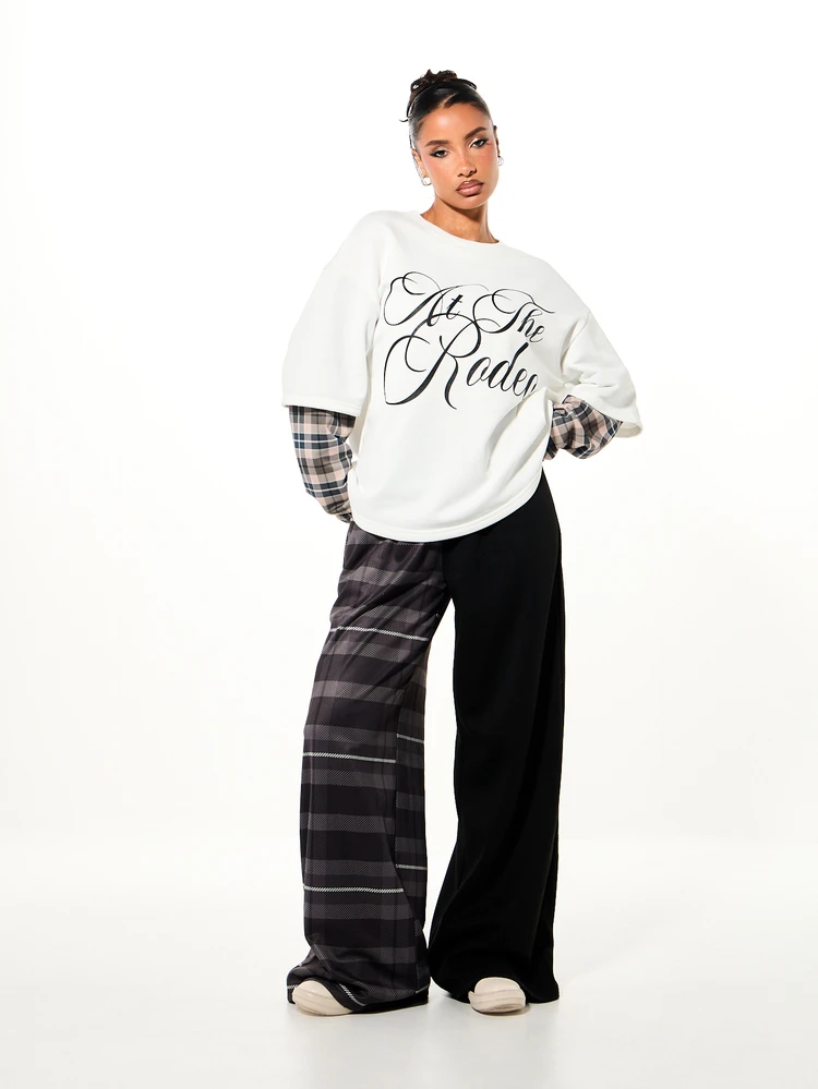 Plus Size Oversized Graphic Sweatshirt Top With Cursive At The Rodeo Script Print And Plaid Contrast Sleeves