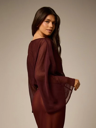 Sheer Cape Top With Bell Sleeves And Puffball Hem