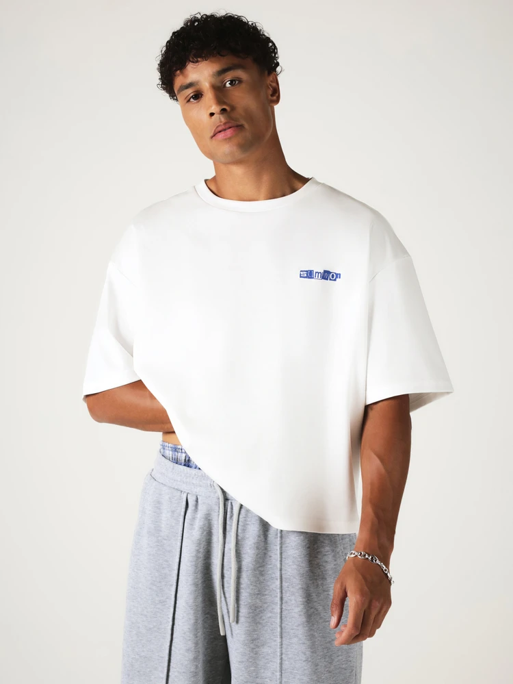 Oversized Boxy Fit Graphic T-Shirt With Bold Back Slogan Print And Small Chest Logo Detail