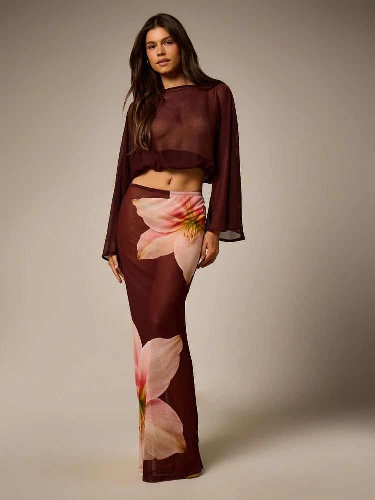 Sheer Cape Top With Bell Sleeves And Puffball Hem