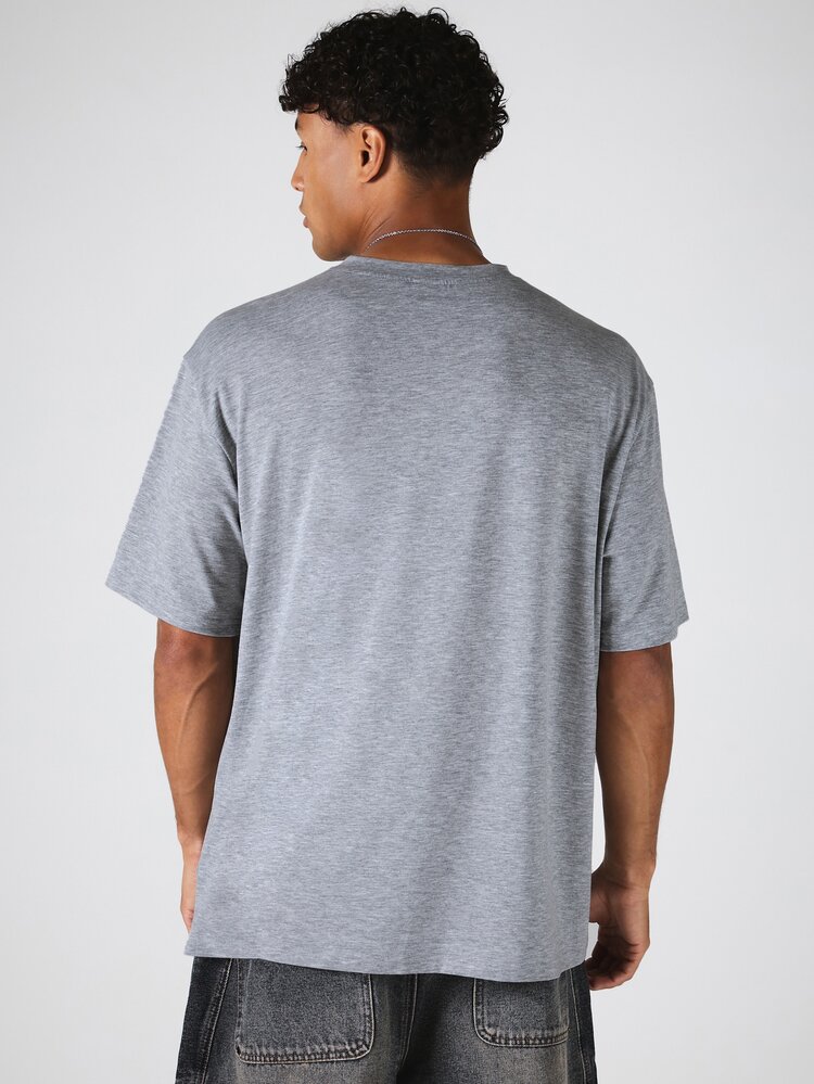 Maglietta girocollo oversize con maniche raglan, in tinta unita melange, con dettaglio di etichetta del marchio, per uso casual quotidiano
