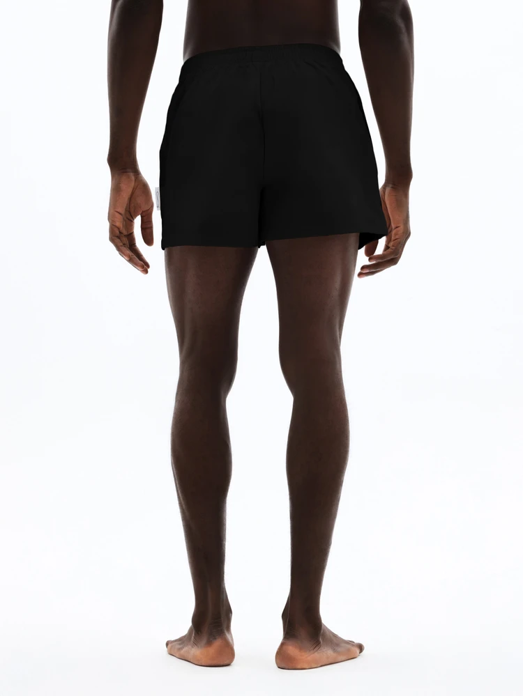 Short de natación sólido con cintura elástica y bolsillo lateral para la playa y las vacaciones