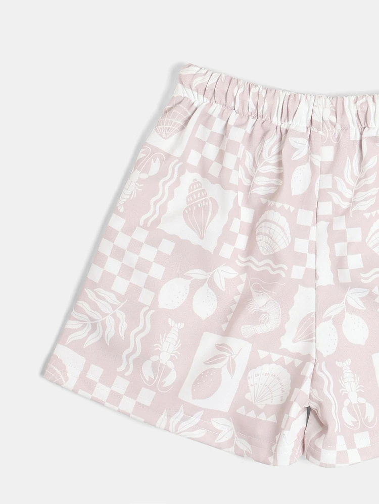 Set coordinato da ragazzo con stampa all-over, composto da maglietta grafica e pantaloncini stampati, collezione estiva da spiaggia
