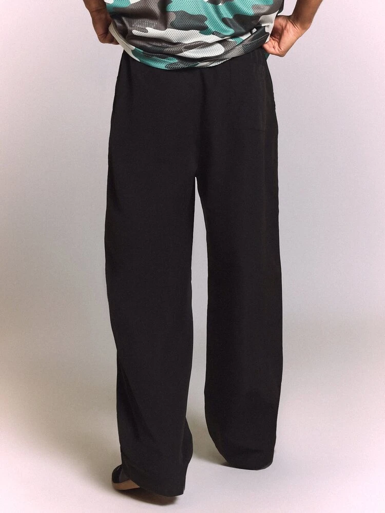 Baggy Fit Pull-On Wide Leg Pants With Cursive Script Leg Print Elastic Waist Streetwear Style