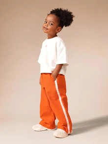 SUMWON Girls Oversized Graphic Tee And Wide Leg Textured Pant Co-Ord Set With Fresh Bakery Back Print And Side Stripe Detail - Orange - View 6