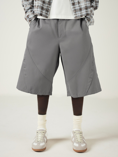 SUMWON Wide Leg Bermuda Shorts With Metal Stud Embellishments And Diagonal Seam Detail For Casual Streetwear