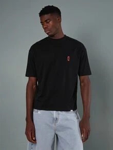 SUMWON Regular Oversized Crew Neck Graphic T-Shirt With Lemon Net Bag Back Print And Logo Chest Emblem Summer Casual Tee - Black - View 2