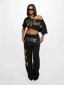 SUMWON WOMEN Off-Shoulder Crop Tee With Diagonal Raw Hem Cut And Gold Script Graphic Print - Black - View 6