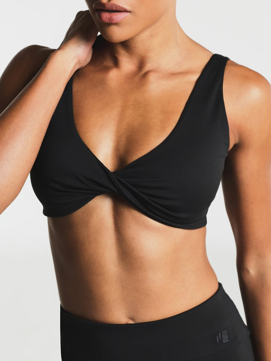 11SKNDS Twist Front Sports Bra Low Impact Padded V-Neck Crop Top Scoop Back Pullover Style With Sweat-Wicking, Stretchy, Breathable & Buttery-Soft, For Gym Workout Studio Summer, Running, Training & Hy-Rox - Black - View 1