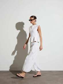 KSTM Sleeveless Peplum Knit Top With Boat Neckline And Waist-Cinching Ribbed Detail For Spring Summer - White - View 4