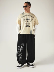 SUMWON Wide Leg Black Sweatpants With Oversized Cursive Script Leg Print Drawstring Hem Streetwear Style - Black - View 2