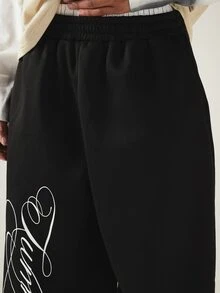 SUMWON Wide Leg Black Sweatpants With Oversized Cursive Script Leg Print Drawstring Hem Streetwear Style - Black - View 5
