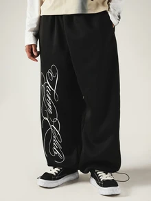 SUMWON Wide Leg Black Sweatpants With Oversized Cursive Script Leg Print Drawstring Hem Streetwear Style - Black - View 4