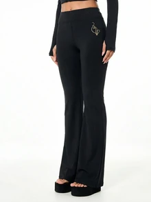 BABYPHAT Gold Script Logo Flare Pants With Cat Logo Detail Mid Rise Full Length Stretch Knit Bootcut Trousers - Black - View 2