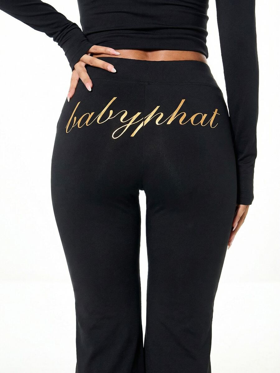 BABYPHAT Gold Script Logo Flare Pants With Cat Logo Detail Mid Rise Full Length Stretch Knit Bootcut Trousers - Black - View 1