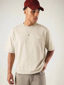 SUMWON Boxy Fit Oversized Graphic T-Shirt With Doberman Back Print And Graffiti Script Logo On Chest Crew Neck Short Sleeve Street Style Tee - Beige - View 2