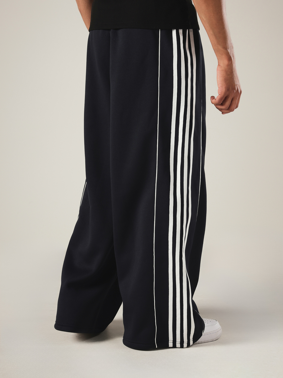 PLAYBOY X SUMWON Crop Fit Wide Leg Track Pants With Side Stripe Detail And Script Logo For Everyday Casual Streetwear Seasonal Style