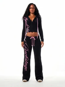 SUMWON WOMEN Ribbed Knit Flare Trousers With Pink Script Logo Print And Bow Tie Waistband Detail For Spring Summer - Black - View 6