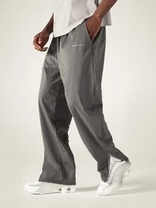 SUMWON Pantalones de chándal de pierna ancha con bajo de abertura lateral, cintura elástica y bolsillos laterales, detalle reflectante, pantalones de tejido color carbón - Gris - Ver 1