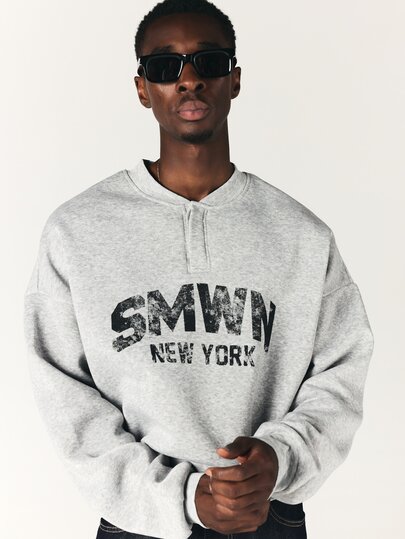 SUMWON New York Oversized Crop Sweatshirt With Henley Neckline Distressed Varsity Chest Print Long Sleeve Pullover Top