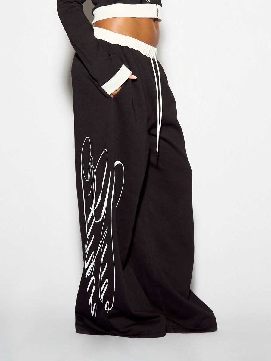 SUMWON WOMEN Crop Fit Wide Leg Drawstring Sweatpants With Contrast Waistband And Large Script Logo Leg Print Casual Relaxed Fit Full Length Trousers - Black - View 1