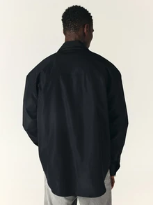 SUMWON Gothic Script Logo Oversized Long Sleeve Button-Up Shirt With Point Collar And Bold Front Print - Black - View 2