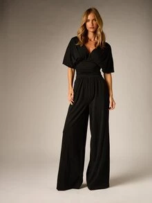 AiiRZ Deep Plunge Wide Leg Full Length Jumpsuit With Batwing Sleeves Ruched Waist And Open Tie Back Detail - Black - View 1