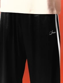 SUMWON Wide Leg Satin Track Pants With Triple Side Stripe Detail And Script Logo Embroidery Elastic Waist Relaxed Fit - Black - View 5
