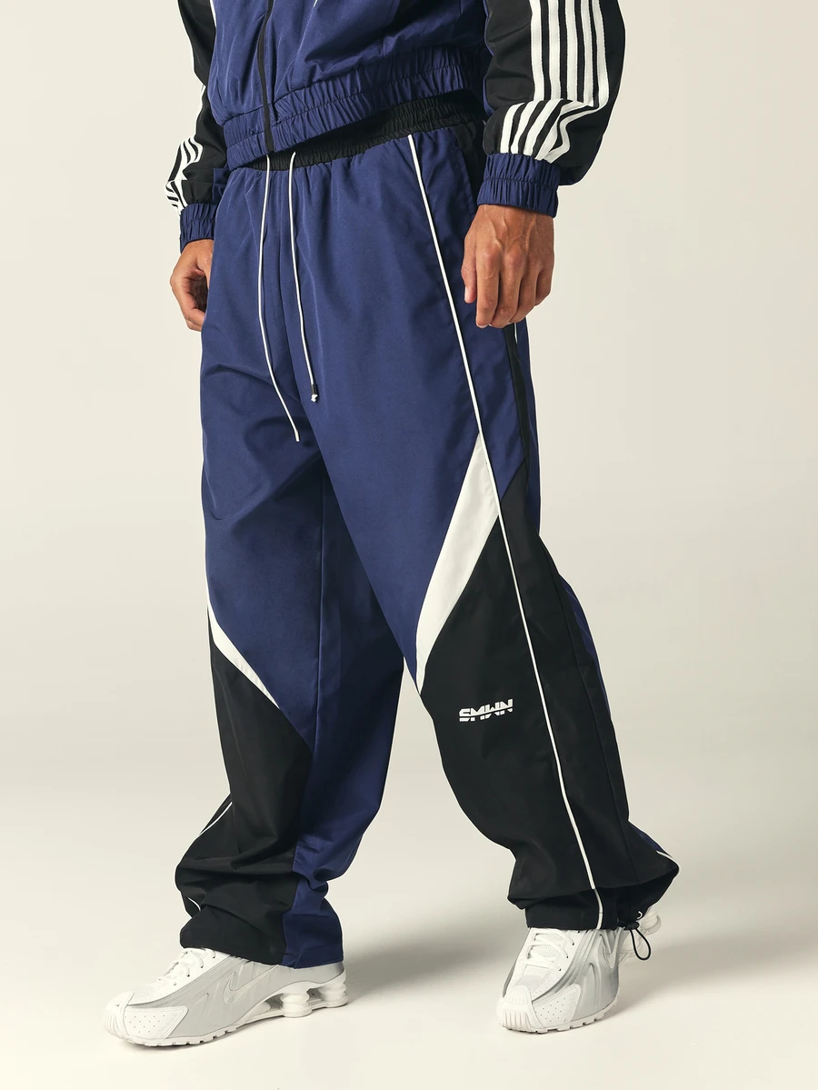 SUMWON Wide Leg Track Pants With Color Block Design And Contrast Piping Drawstring Waist Elastic Ankle Cuffs - Black - View 1