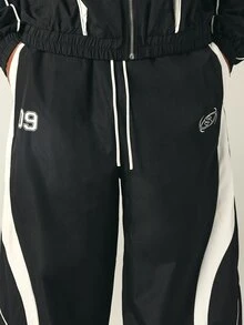 SUMWON Wide Leg Track Pants With White Contrast Panels Piping Elastic Waist Drawstring Ankle Hem Logo Embroidery Number Patch Fall Winter - Black and White - View 5