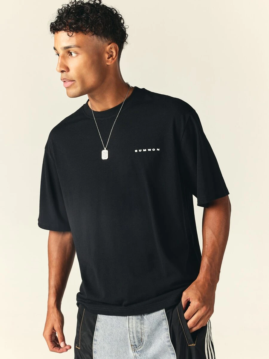 SUMWON Oversized Crew Neck Short Sleeve Solid Black T-Shirt With Small Chest Logo Print, Relaxed Casual Everyday Essential Tee - Black - View 1