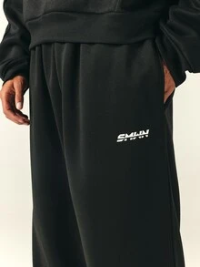SUMWON Oversized Loose Fit Sweatpants With Elasticated Waist Drawstring And Side Stripe Detail Full Length Jogger Trousers - Black - View 5