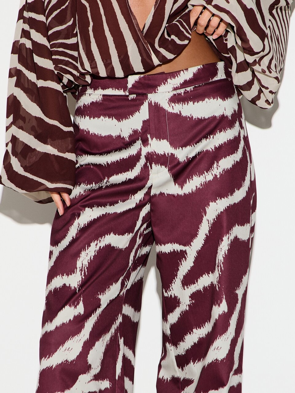 KIZN High Rise Wide Leg Satin Pants With Zebra Print