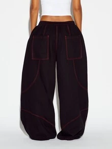 SUMWON WOMEN Oversized Baggy Casual Pants With Red Contrast Stitching Vertical Logo Leg Print And Elastic Ankle Drawstring Detail - Black - View 5
