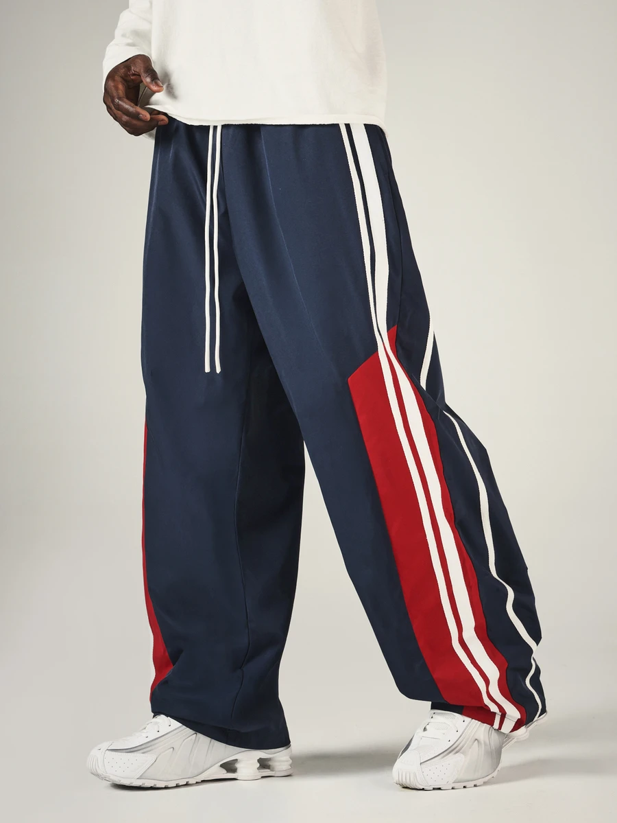 SUMWON Wide Leg Track Pants With Side Stripe Color Block Design Drawstring Waist And Embroidered Logo Detail - Navy Blue - View 1