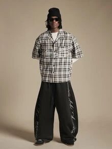 SUMWON Oversized Plaid Short Sleeve Button-Up Camp Collar Shirt With Cursive Script Front Graphic And Varsity Back Print - Black - View 3