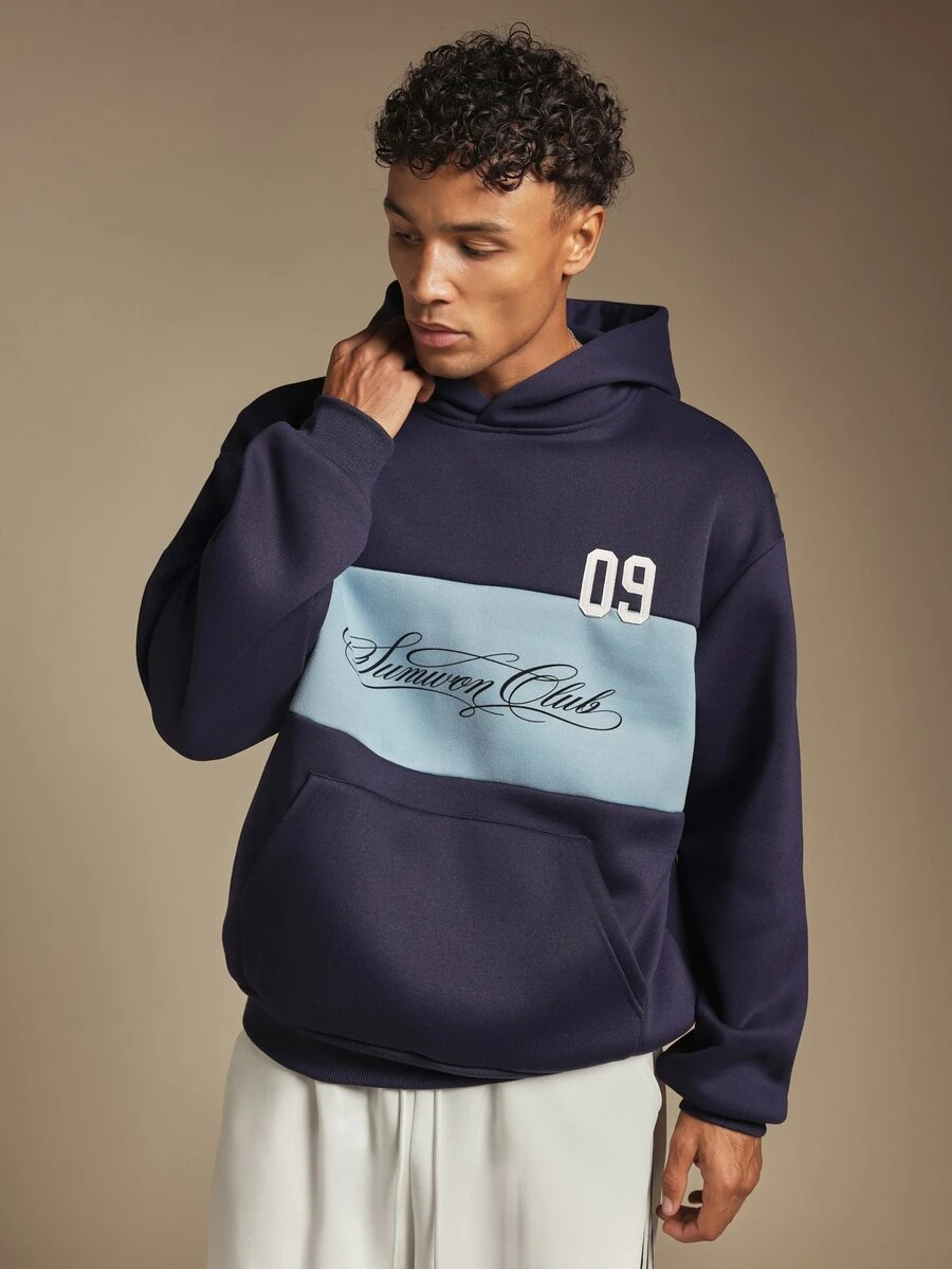 SUMWON Club Oversized Hoodie Color Block Chest Script Print Embroidered Number Pullover Centre Pocket Long Sleeve Winter Essential - Navy Blue - View 1