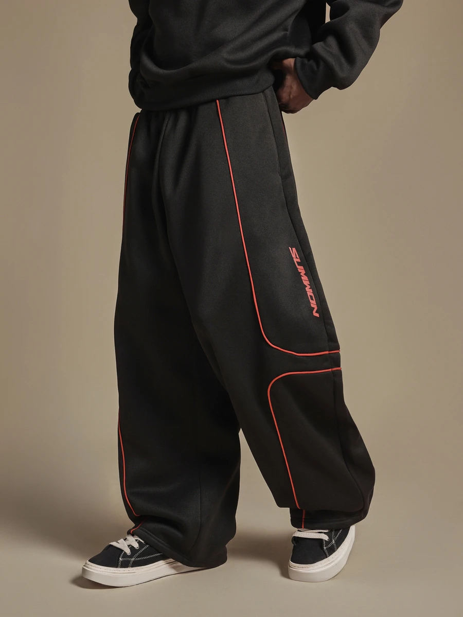 SUMWON Wide Leg Track Pants With Red Contrast Piping And Logo Print Curved Panel Detail Elastic Waistband Full Length - Black - View 1