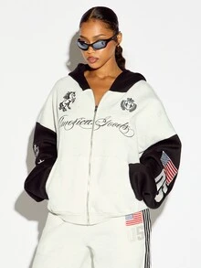 SUMWON WOMEN Boxy Fit America Goods Full-Zip Oversized Sweatshirt With Embroidered Unicorn Sheild Graphic And American Flag Patch Sleeve Detail - Black and White - View 1