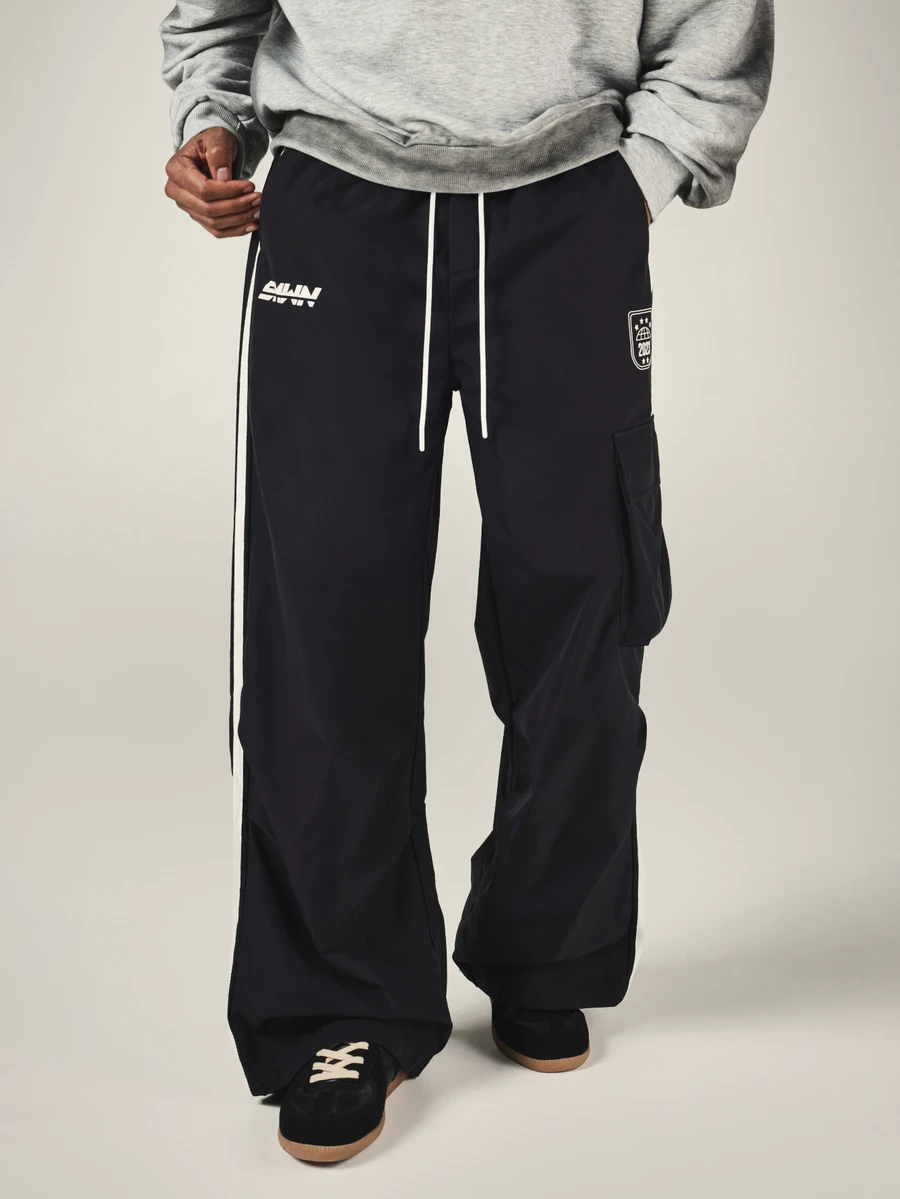 SUMWON Wide Leg Black Cargo Track Pants With Contrast Side Stripe Drawstring Waist And Thigh Pocket Logo Detail - Black - View 1