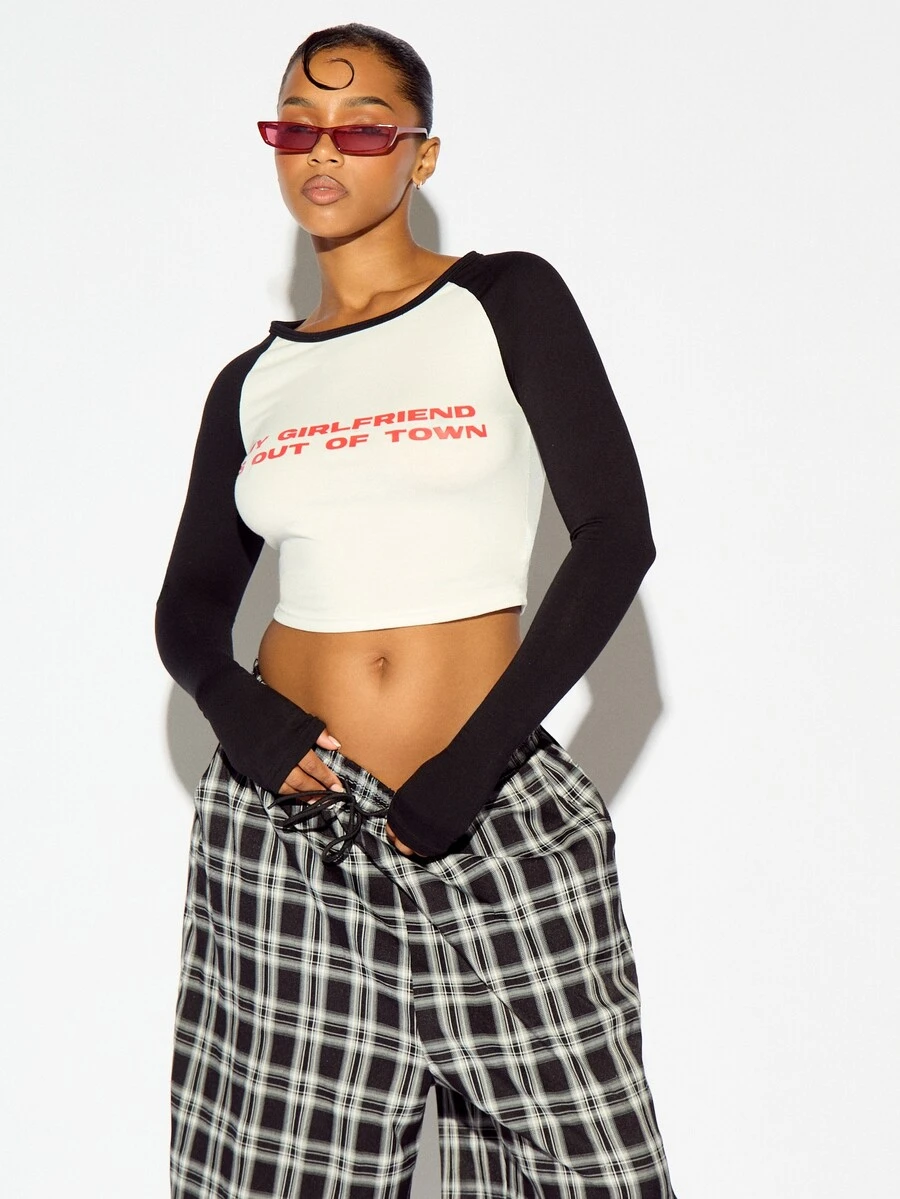 SUMWON WOMEN Raglan Long Sleeve Crop Top With Contrast Sleeves And Humorous Chest Text Print For Casual Everyday Wear - Black and White - View 1