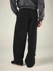 SUMWON Oversized Wide Leg Black Sweatpants With Bold Vertical Side Leg Logo Print And Drawstring Waist - Black - View 2