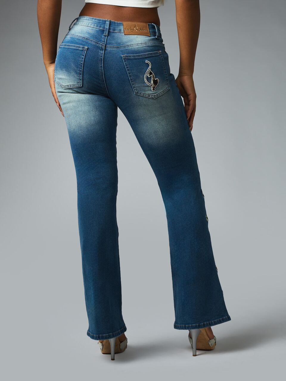 BABYPHAT LOW RISE STRETCH DENIM BOOTCUT JEANS IN VINTAGE WASH WITH APPLIQUE DETAIL