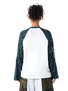 SUMWON WOMEN Oversized Raglan Long Sleeve Top With Camo Print Sleeves And Graphic Logo Detail Crew Neck Colorblock Tee - Navy Blue - View 2