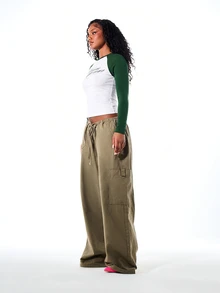 SUMWON WOMEN Crop Raglan Long Sleeve Top With Contrast Forest Green Sleeves And Cursive Script Graphic Print On Chest - Green - View 5