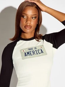 SUMWON WOMEN Made In America License Plate Graphic Crop Raglan Top With 3/4 Black Contrast Sleeves And Crew Neck - Black and White - View 3