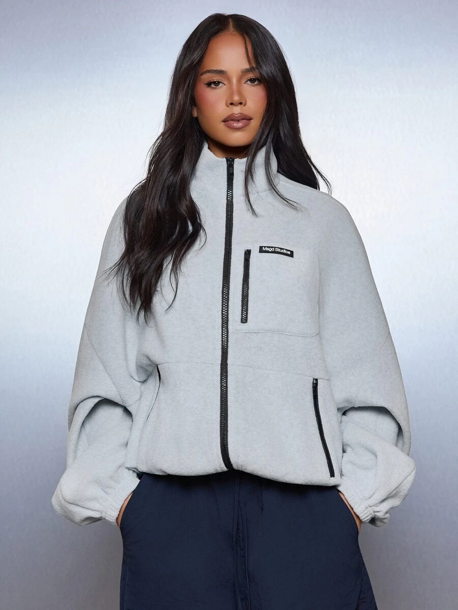 MISSGUIDED جاكيت صوف واسع الحجم بسحاب كامل مع ياقة عالية وتفاصيل سحاب أسود متباين وجيوب جانبية ضروري للشتاء - رمادي فاتح - مشاهدة 1