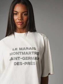 MISSGUIDED Oversized boxig croptop med texttryck av Paris kvarter, mock neck, kort ärm, statement-topp - Vitt - Visa 5