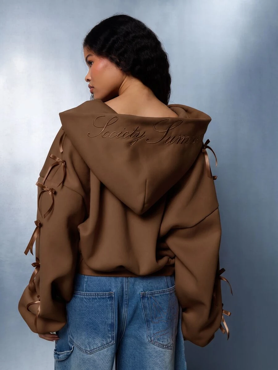 SUMWON WOMEN Winter Essentials Oversized Cropped Sweatshirt Zip-Up With Ribbon Bow Sleeve Detail And Embroidered Script Logo Back Hood Autumn Warm Cozy - Chocolate Brown - View 1